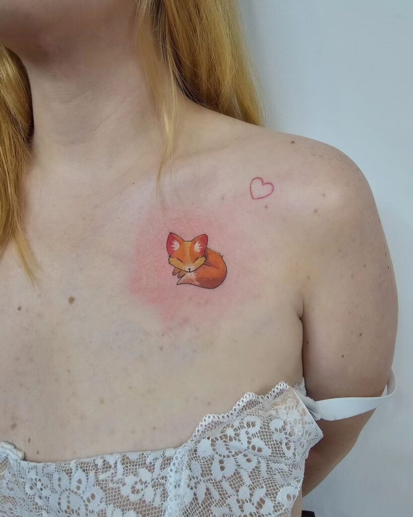 Cute Miniature Fox Tattoo on the Collarbone, a Tiny Sleeping Fox in Color: Tiny Dreams