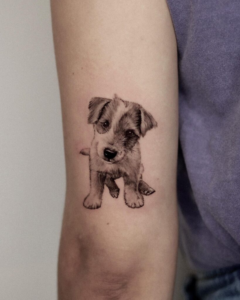 Cute Puppy Front View Portrait Tattoo on the Back of the Above Elbow: Puppy Love