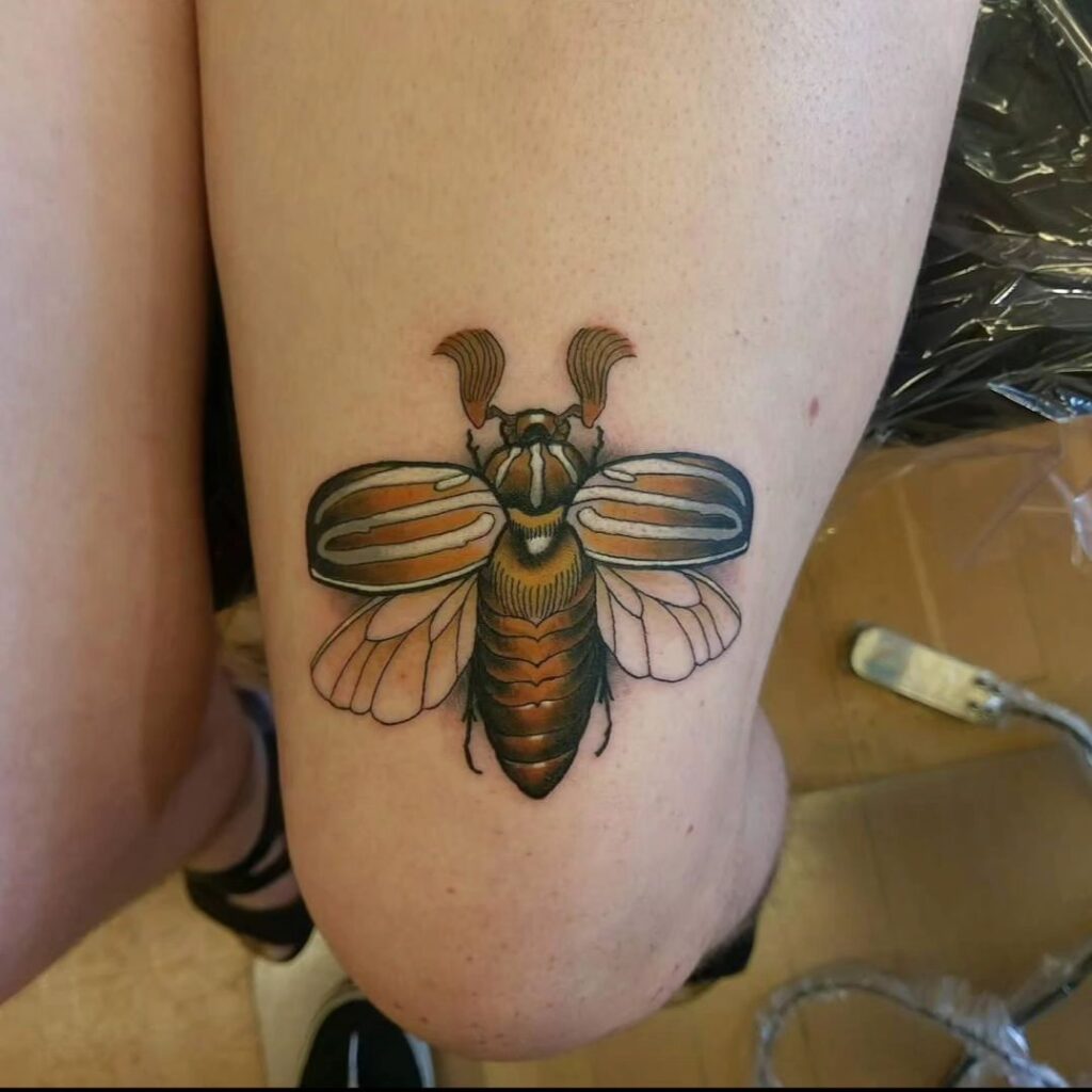 Cute realistic june bug tattoo above the knee tiny beauty