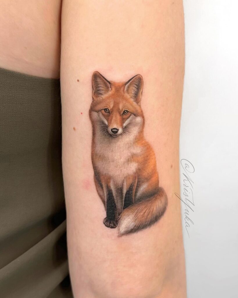 Cute Sitting Fox with Colorful Tattoo Above the Back Elbow, Front View with Long Tail: Little Charm