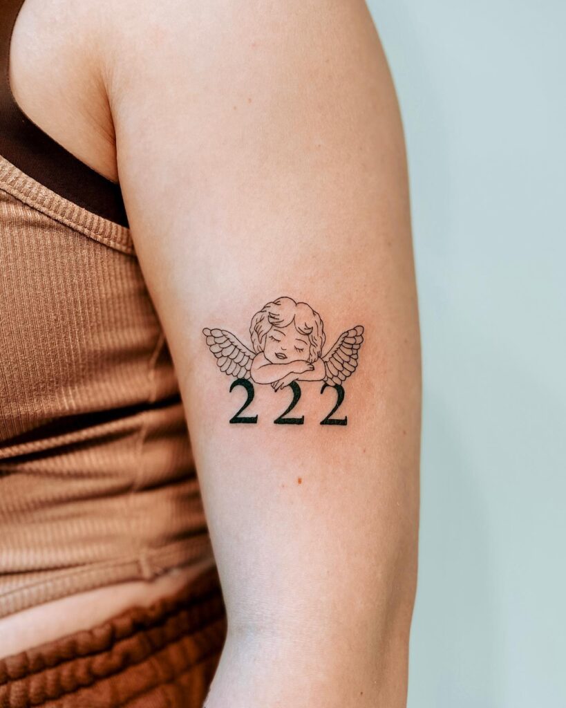 Cute Sleeping Angel Pattern Tattoo with Number 222 on the Upper Arm, a Serene Scene: Angelic Slumber 