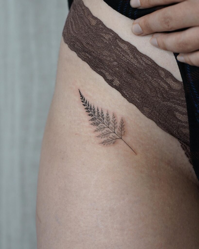 Cute Small Hip Fern Tattoo for Female: Botanical Beauty, an Elegant and Earthy Adornment