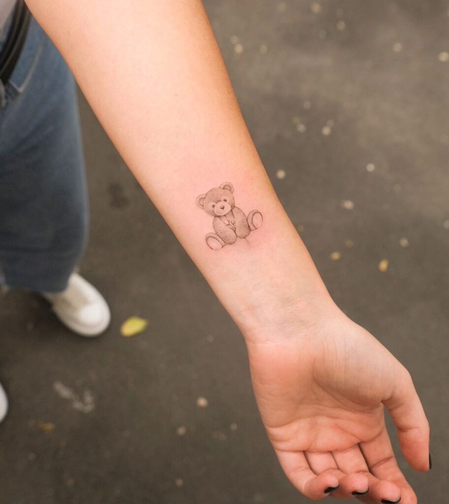 Cute Teddy Bear Tattoo Lightly Shaded on the Forearm: Tiny Companion
