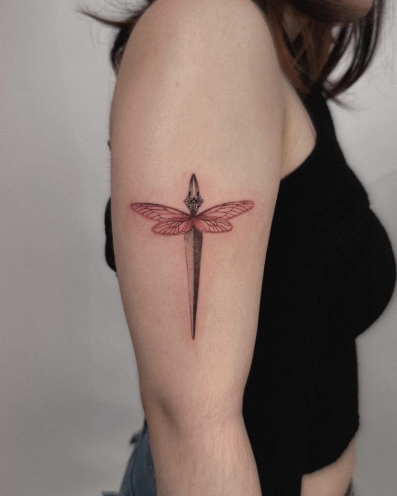 Dagger and Dragonfly Fusion Tattoo Symbolizing Strength and Transformation