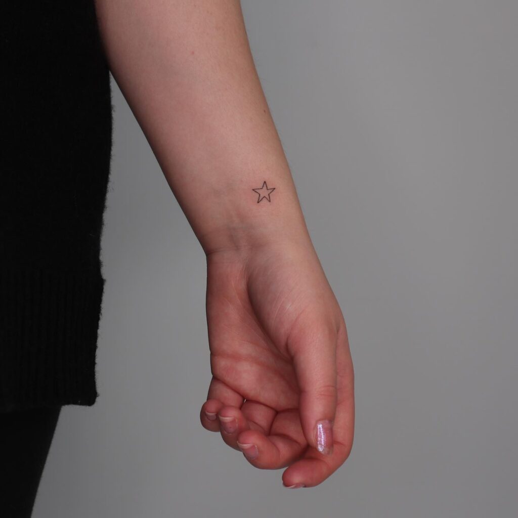 Dainty Star Outline Thin Line Tattoo on the Inner Side, a Tiny Cosmic Accent: Celestial Whispers