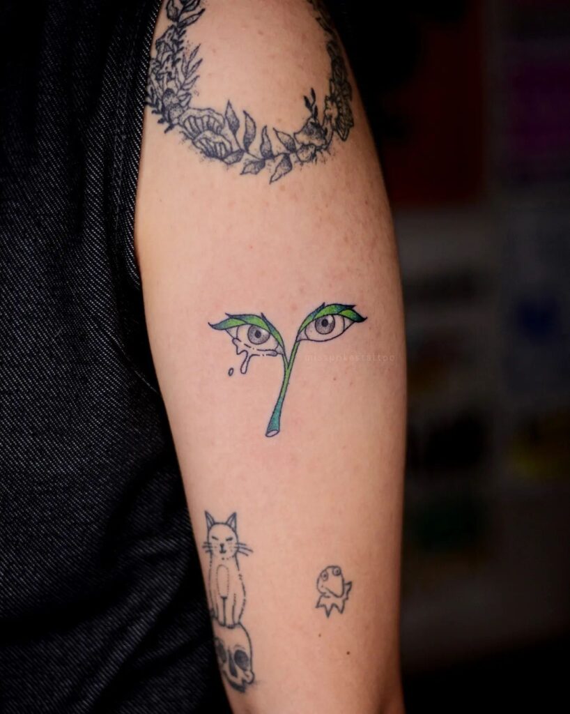 Daring Leafy Eye Tattoo Design With Flowers On Hand