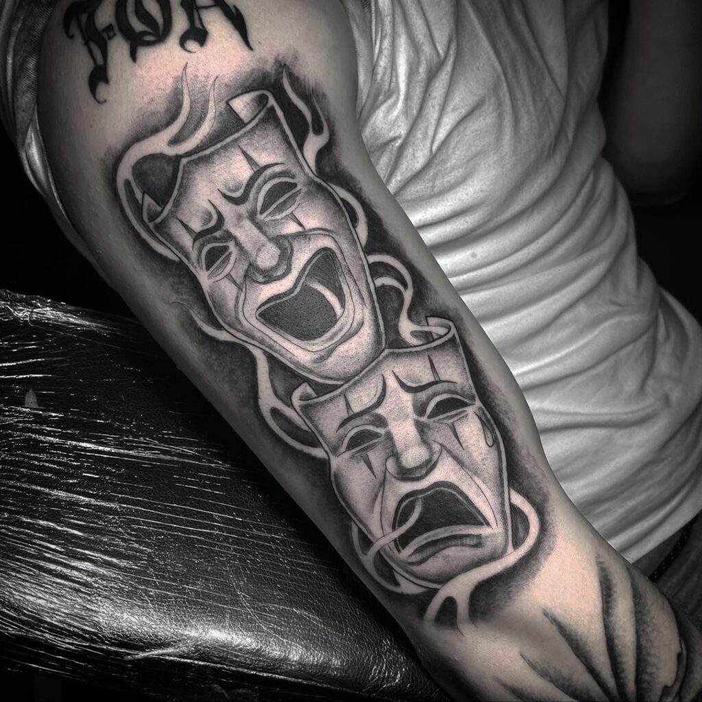 Dark Color Laugh Now Cry Later Tattoo Embracing Contrast and Depth 