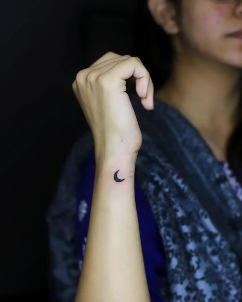 Dark moon side wrist tattoo for girls discover the elegance of lunar inspired wrist art