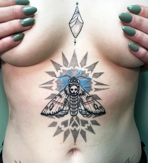 Death moth sternum tattoo