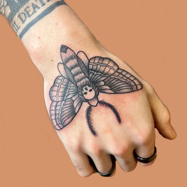 Death moth tattoo 60