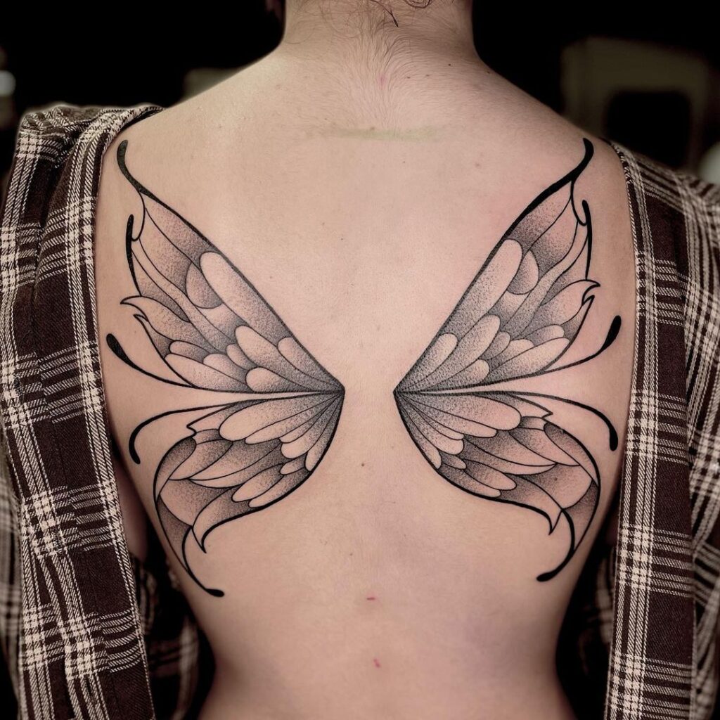 Delicate & captivating butterfly wings back tattoo