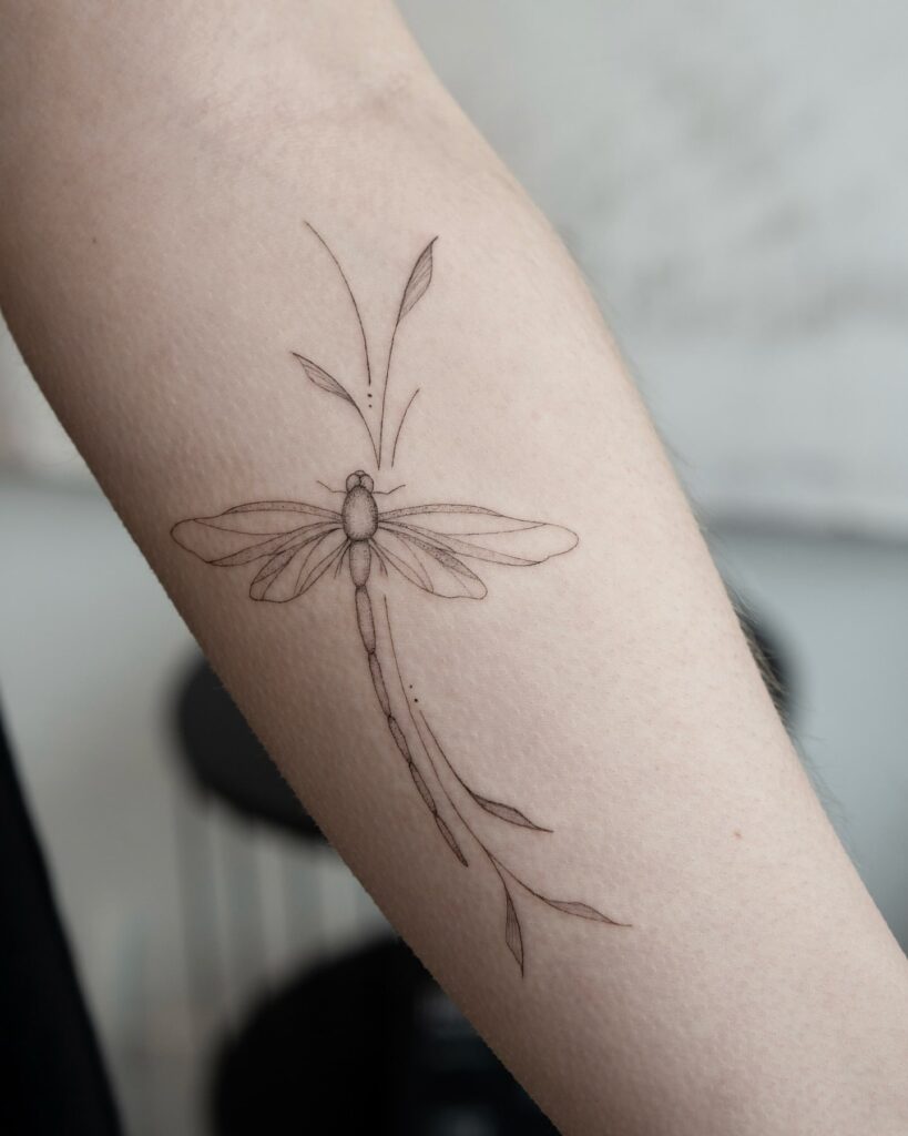 Delicate Dragonfly Tattoo with Leaves Fine Line Nature Inspired Design