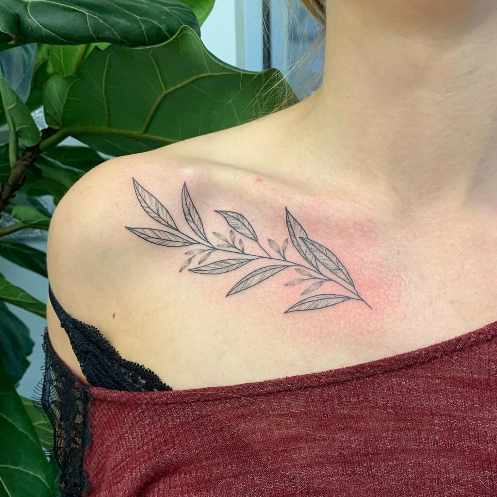 Delicate leafy collarbone tattoo, a natureinspired feminine design leafy whimsy
