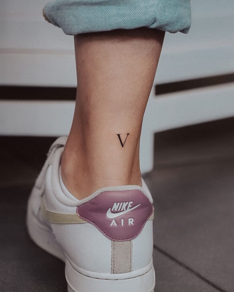 Delicate Letter 'V' Tattoo on the Back of the Ankle: Ankle Accent
