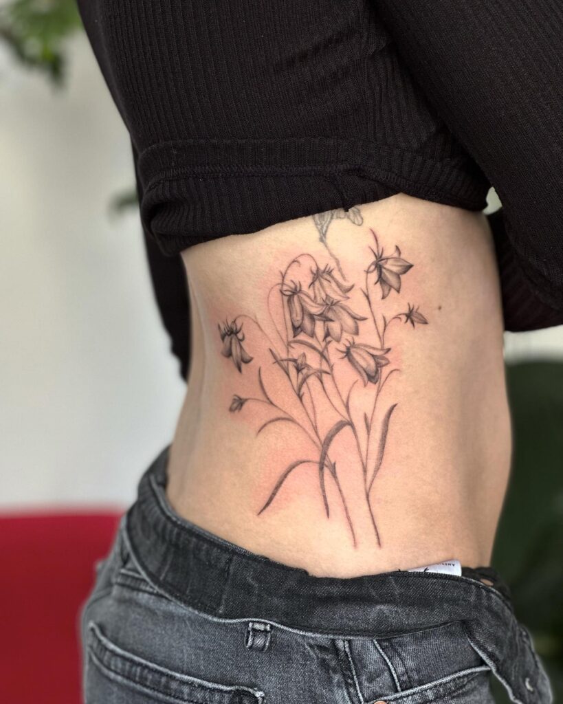Delicate waist bluebell tattoo ideas for females fine line beauty