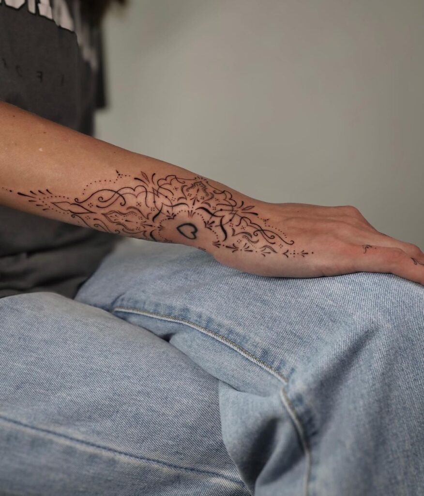 Delicate wrist ornament tattoo a subtle side wrist design