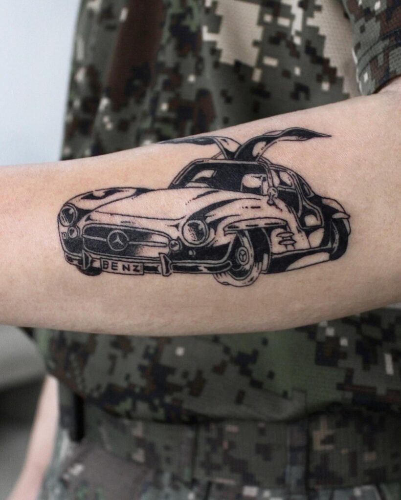 Detailed Black and Gray Mercedes-Benz 300SL Tattoo with Gullwing Doors on Outer Forearm – Car Tattoo Ideas
