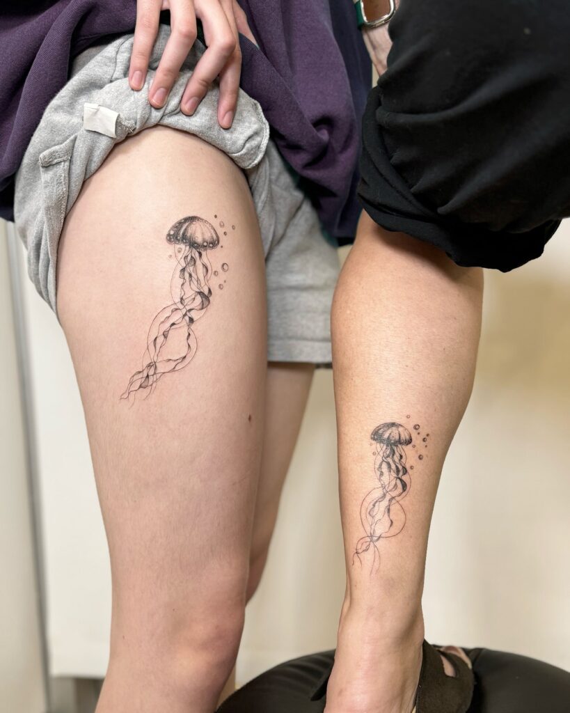 Detailed jellyfish tattoo symbolizing resilience and connection