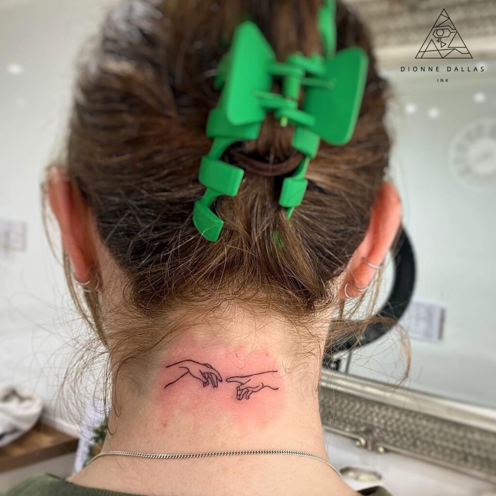 Divine inspiration creation of adam tattoo outline on the nape of the neck