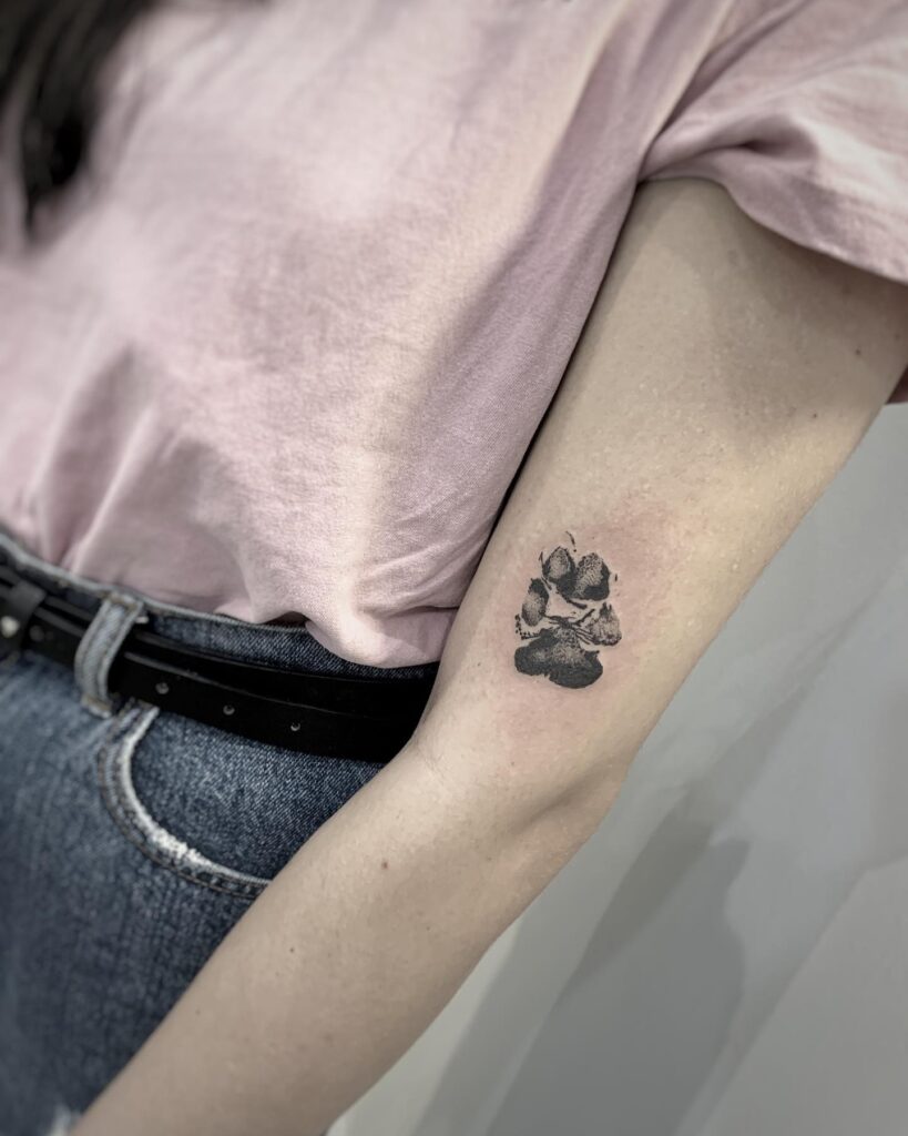 Dog Paw Print Tattoo on the Side of the Elbow for Canine Charm: Elbow Paw
