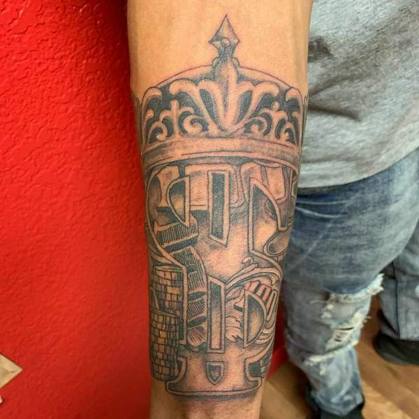 Dollar Sign Forearm Tattoo