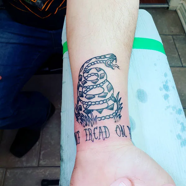 Don't tread on me wrist tattoo