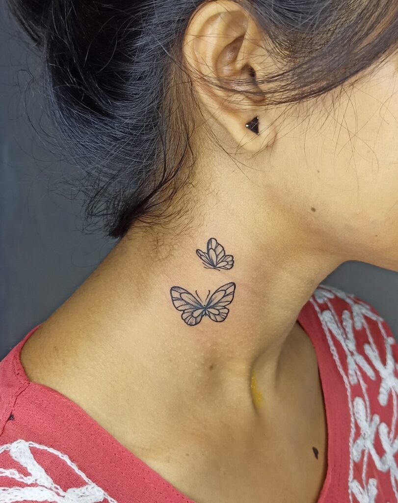 Double beauty mini black butterflies behind the ear and on the neck side
