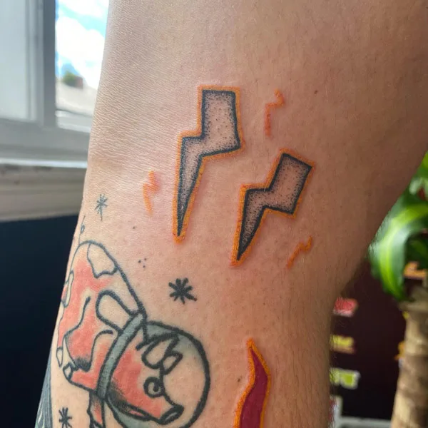 Double lightning bolt tattoo