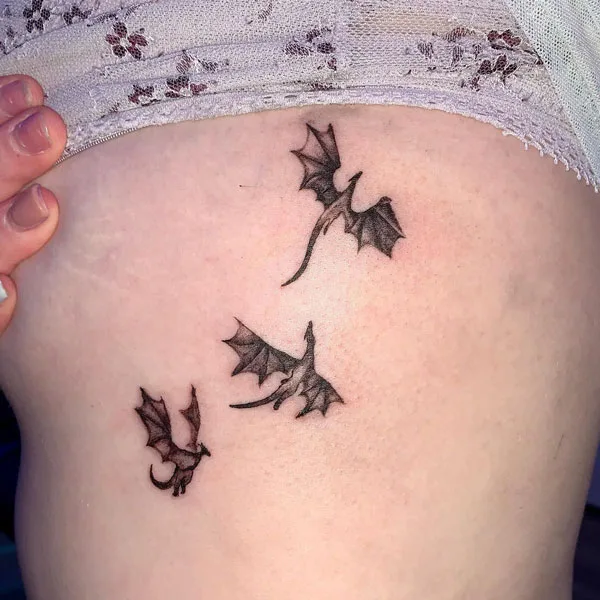 Dragon side boob tattoo