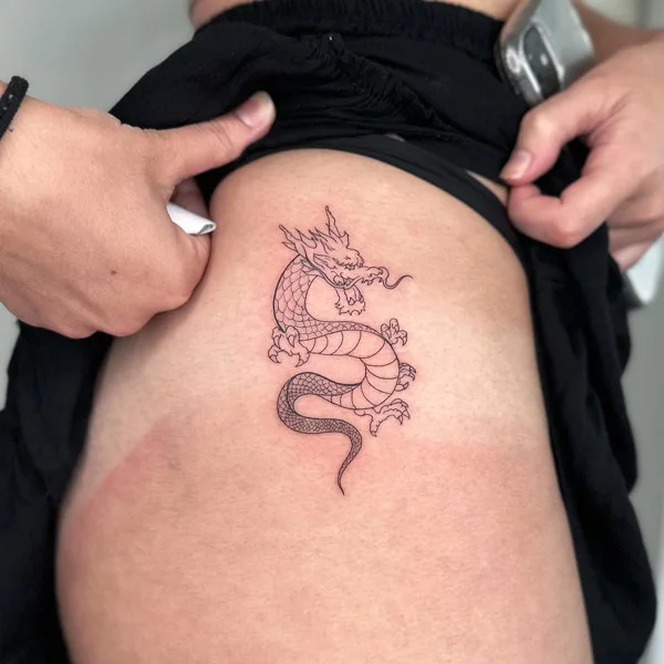Dragon tattoo on thigh 25