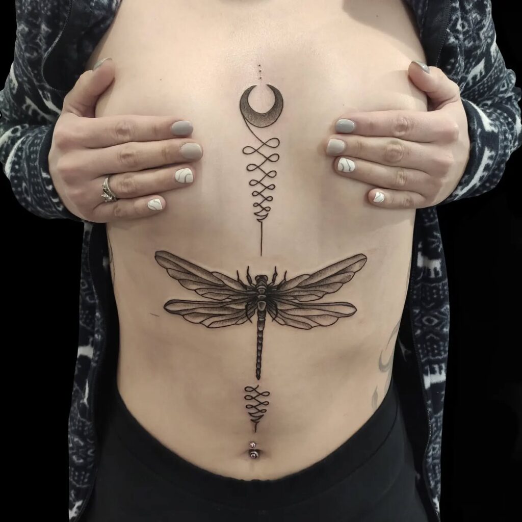 Dragonfly and Crescent Moon Tattoo on Torso Spiritual and Mystical Design