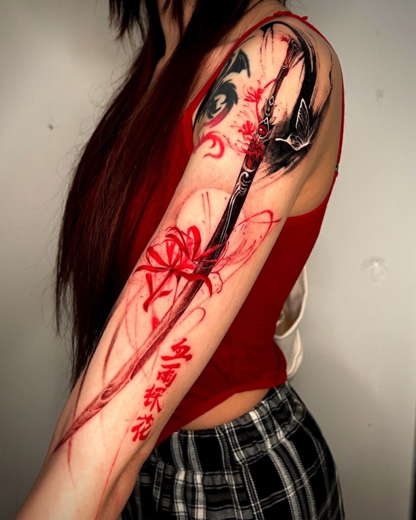 Dramatic black and red tattoo sleeve with a sword and red spider lilies