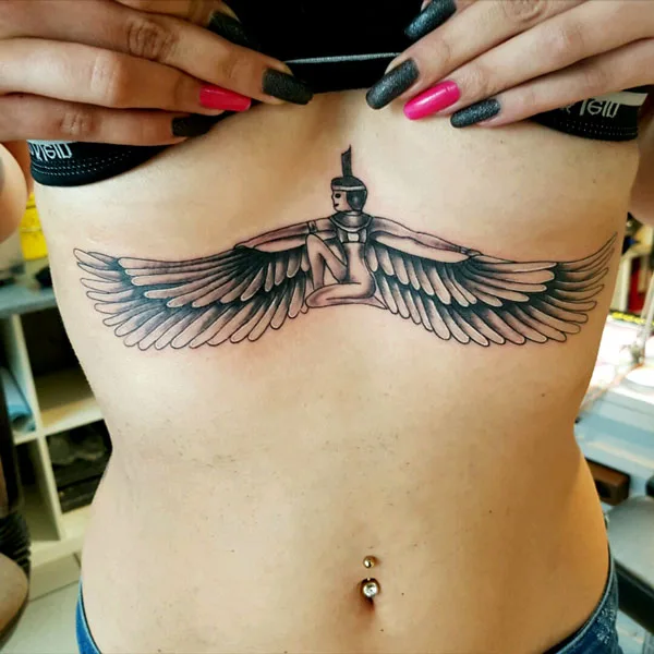 Egyptian under boob tattoo