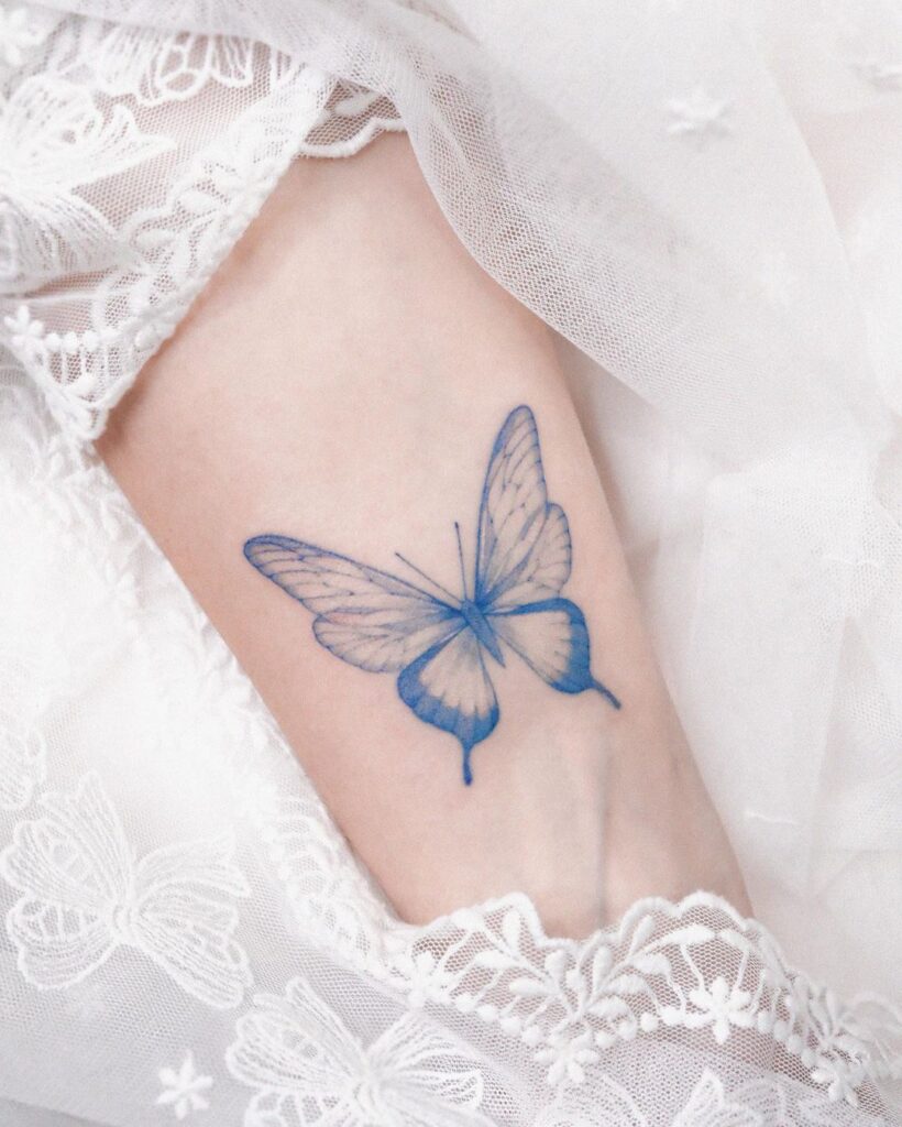 Elegance in flight explore a cute blue butterfly wrist tattoo design