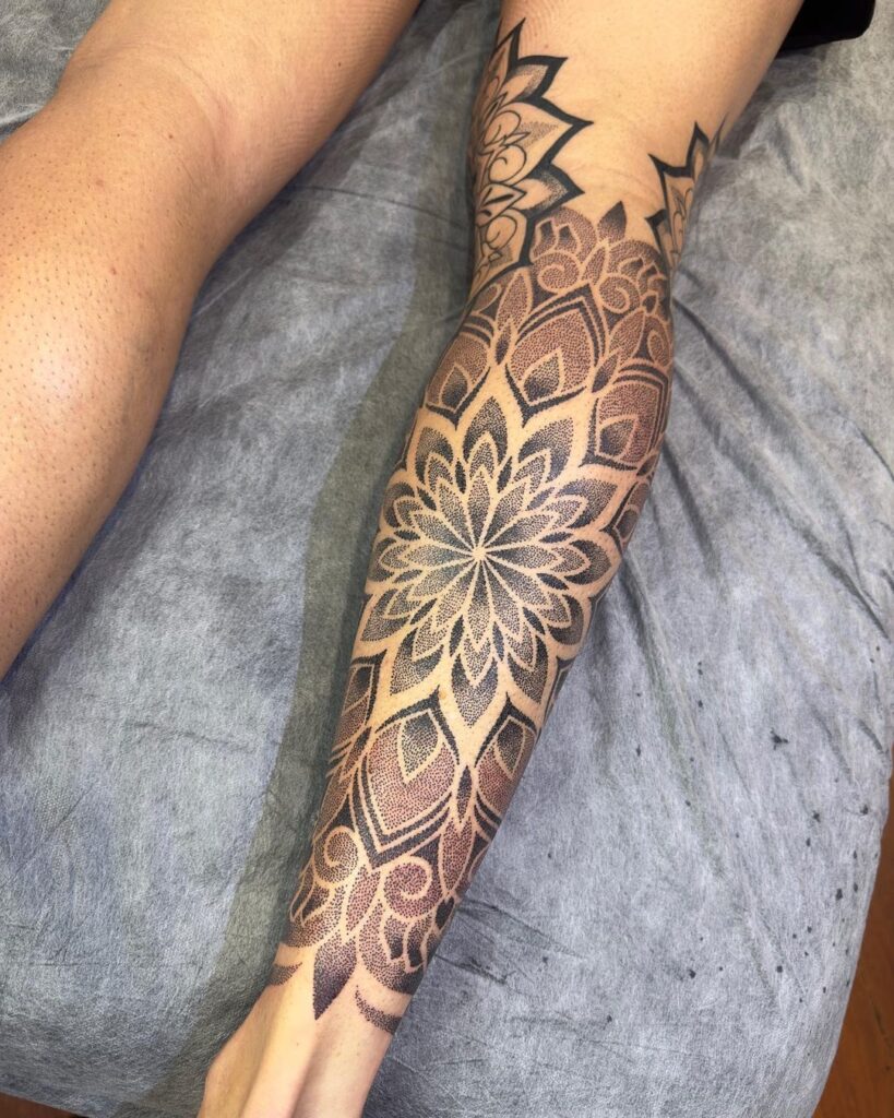 Elegance in geometry mandala calf tattoo design ideas 