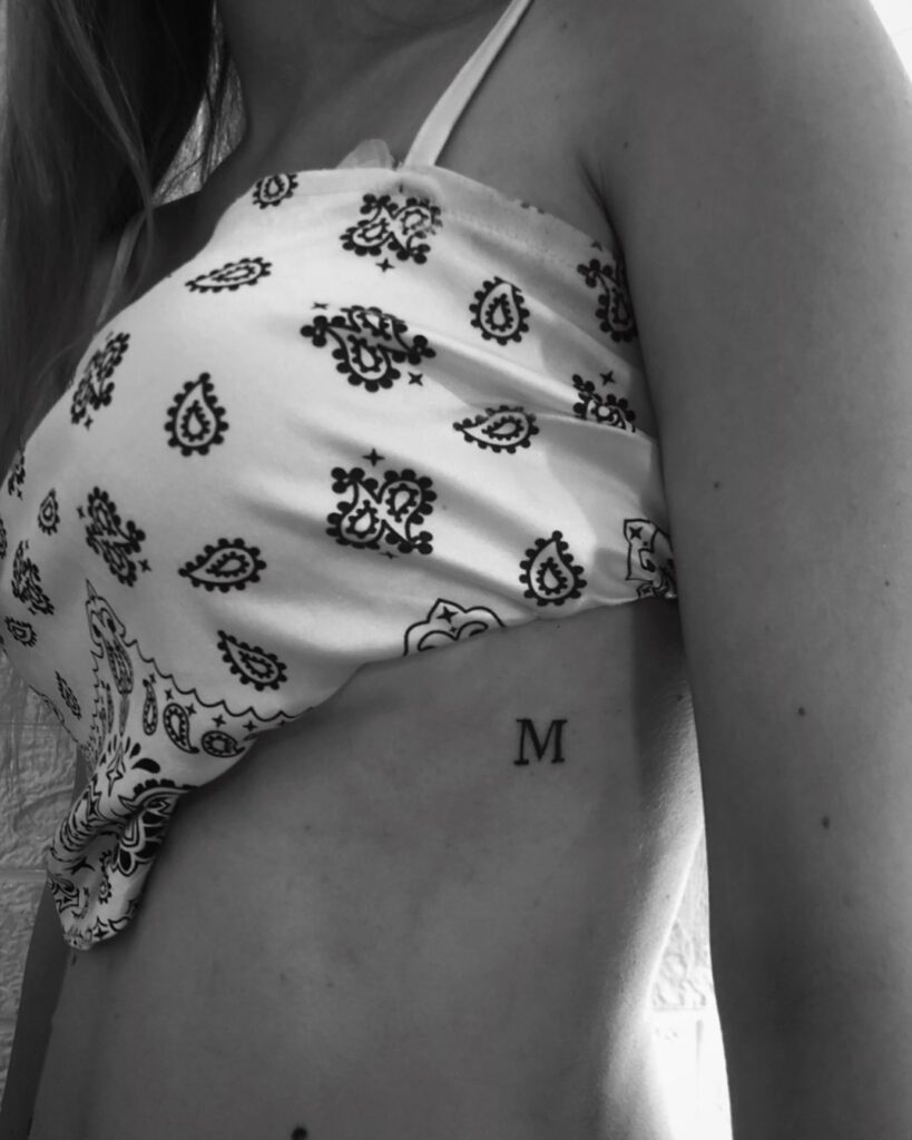 Elegant 'M' Letter Tattoo for Girls: Rib Charm