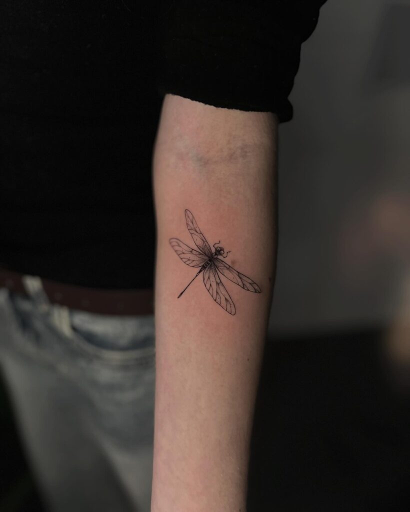 Elegant Fine Line Dragonfly Tattoo for Women Minimalist Forearm Design