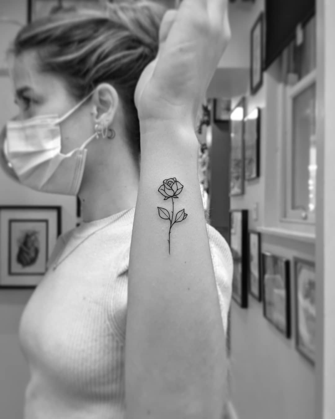 Elegant fine line rose tattoo on inner forearm beauty growth