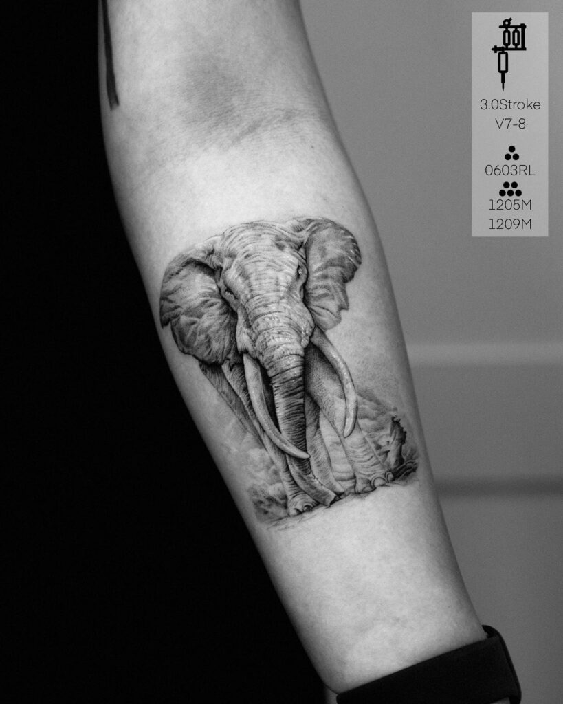 Elegant front side view elephant tattoo in detailed black work: forearm majesty