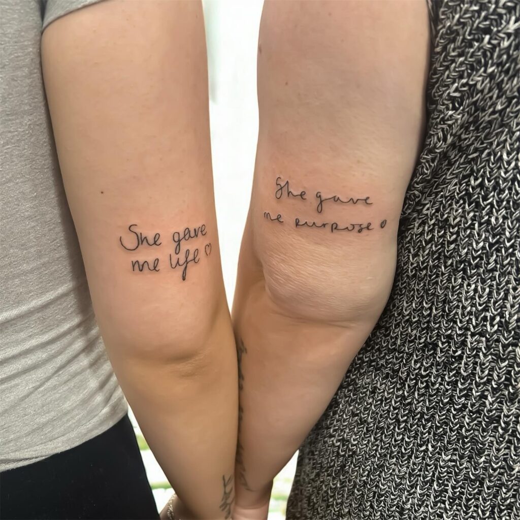 Elegant Handwritten Script Mother Daughter Tattoos with Small Heart Details