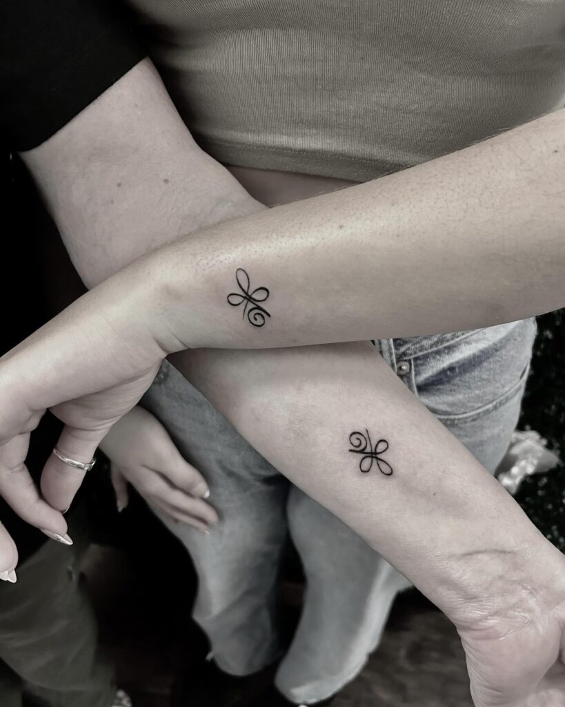 Elegant Infinity Knot Mother Daughter Tattoos Representing Eternal Bond