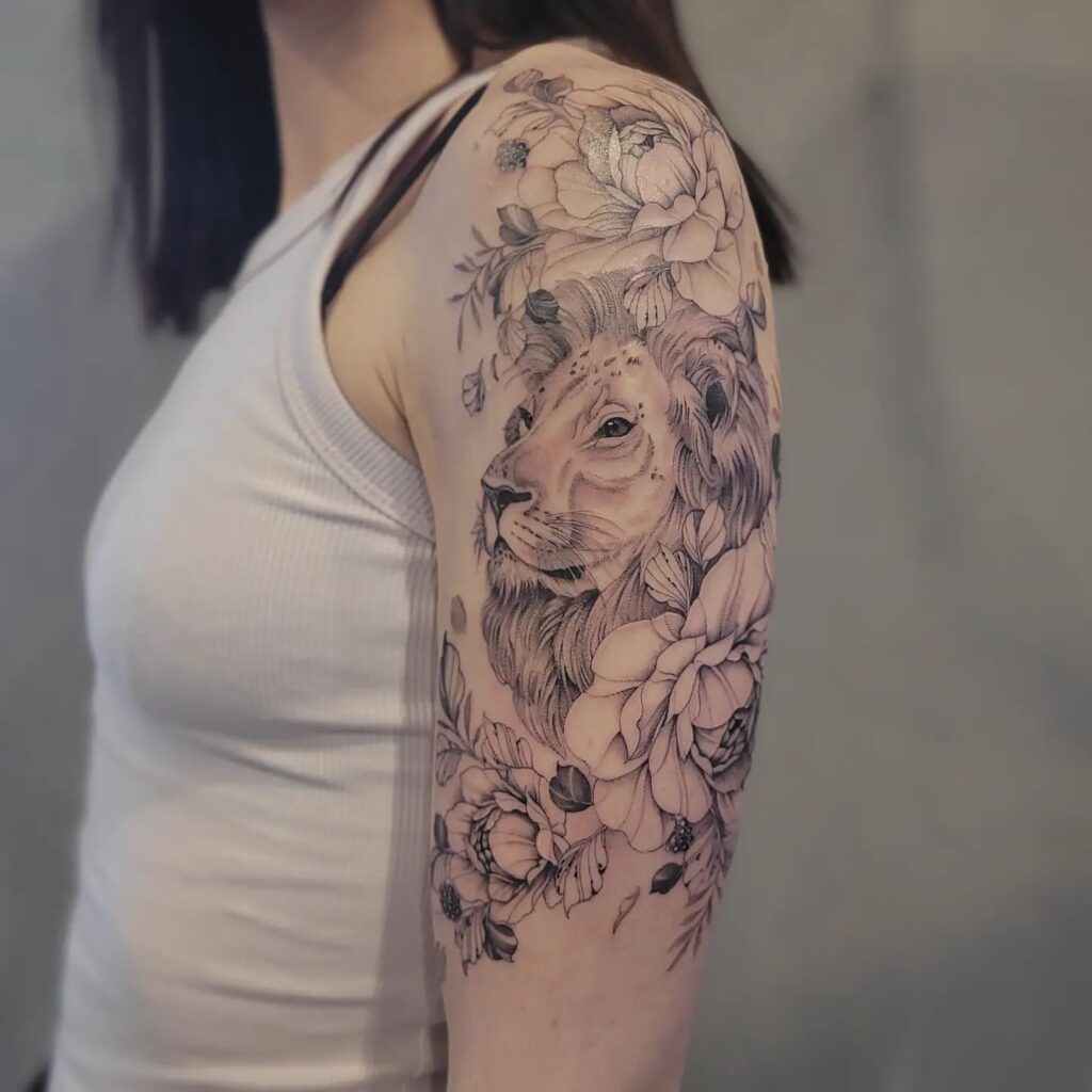 Elegant lion and floral half sleeve a majestic design for women
