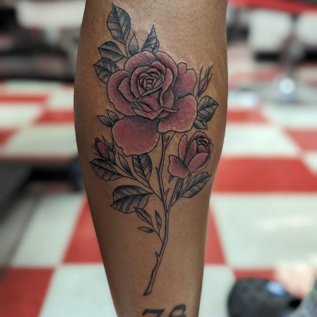 Elegant red rose with black and grey stem calf tattoo beauty 
