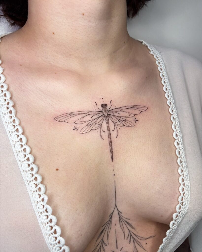 Elegant Upper Chest Dragonfly Tattoo with Ornamental Flowing Accents