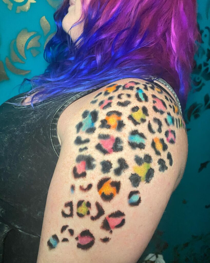 Elegantly Colorful Cheetah Print Tattoo on Left Shoulder