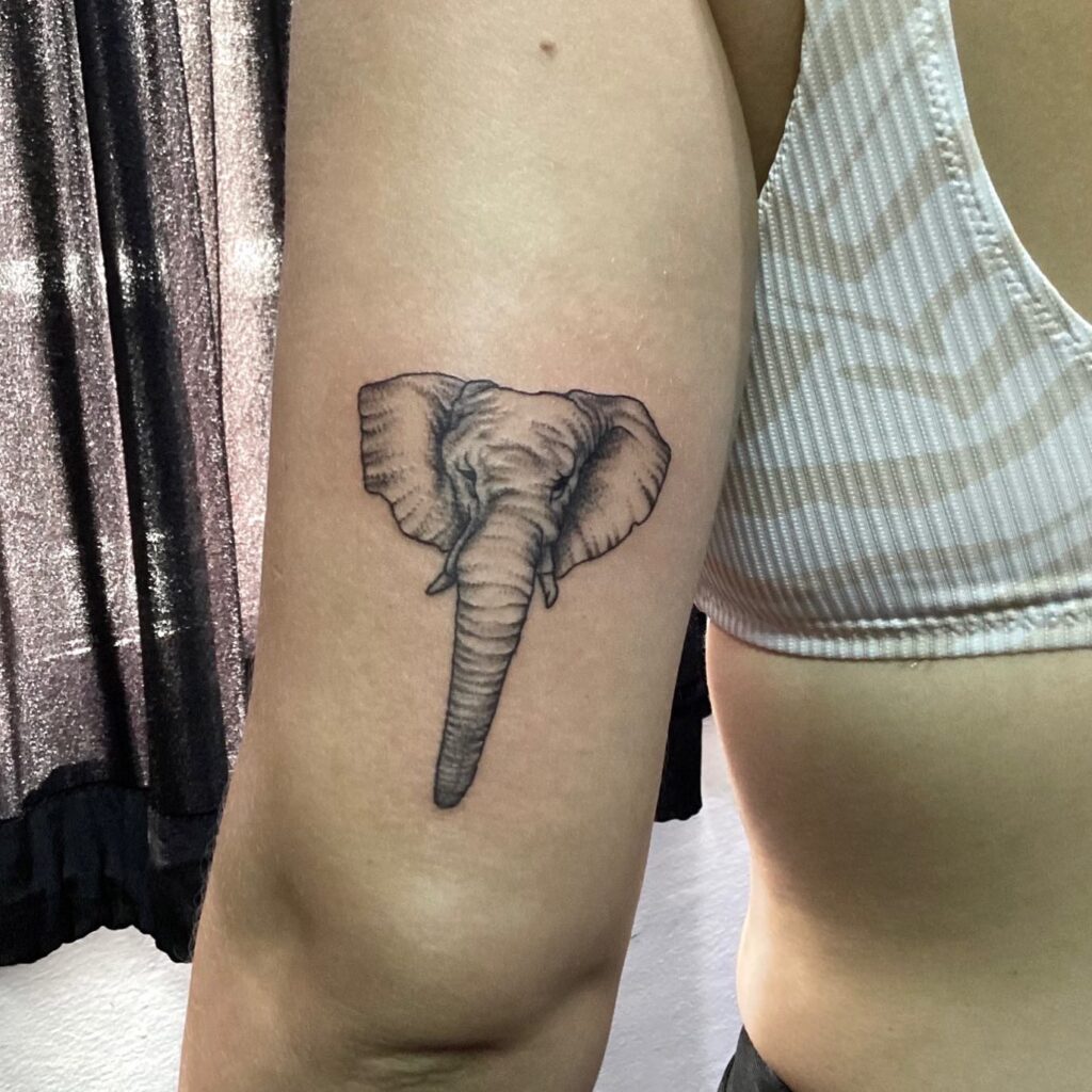 Elephant head tattoo in precise artistry: detailed back of elbow splendor