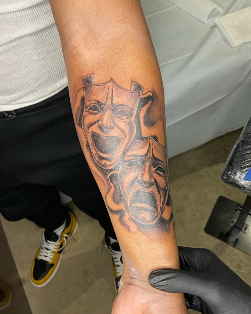 Emotive ink laugh now cry later tattoo on inner forearm 
