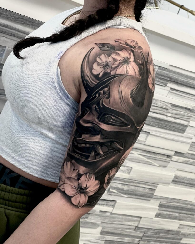 Everblacktattoo Hanya with Bold Flowers Half Sleeve: Cultural Elegance and Floral Charm