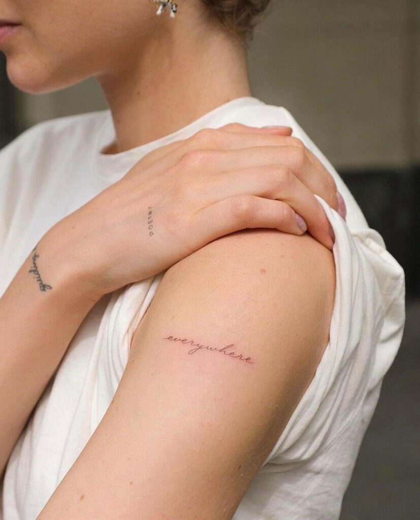 Everywhere Handwriting Script Lettering Tattoo on the Upper Arm, A Call to Explore: Wanderlust Whispers