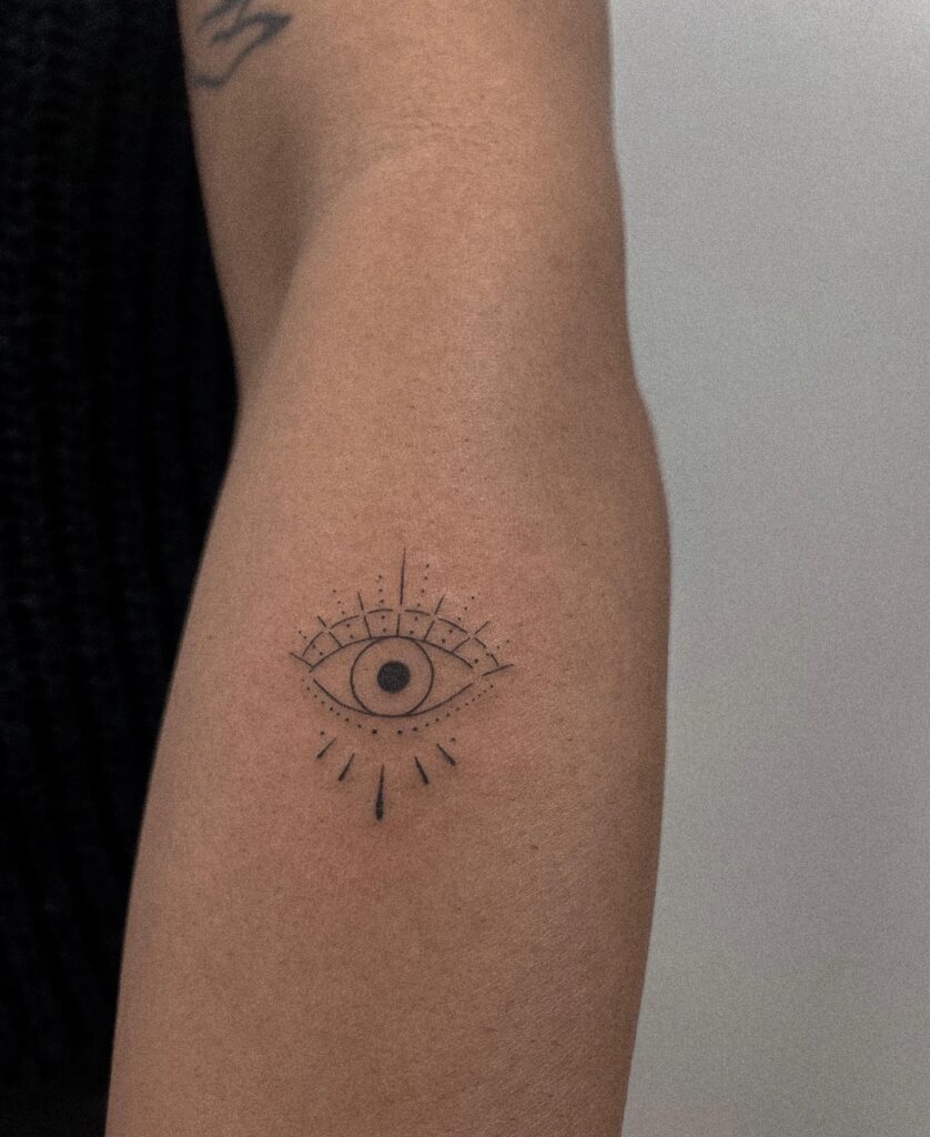 Evil Eye Tattoo in Fineline Style on Forearm: Minimalist Ward